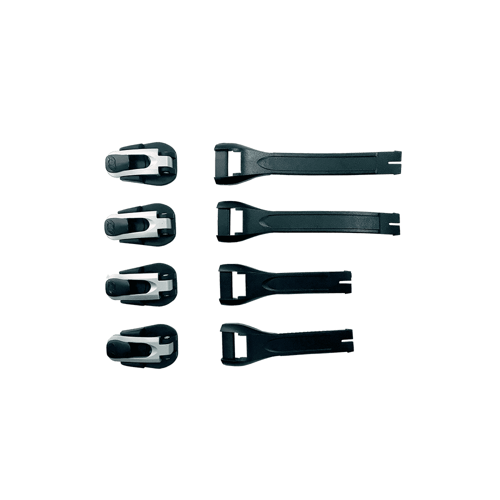 Six pièces O'NEAL RMX Bottes Full Buckle/Strap Kit avec des boucles noires et blanches disposées verticalement sur le côté gauche et des lanières noires sur le côté droit sont représentées sur un fond vert uni.
