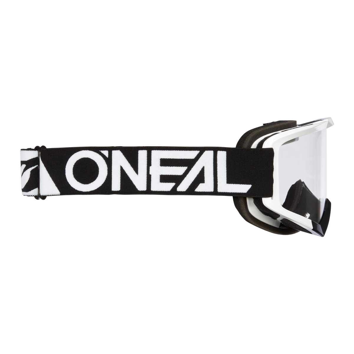 Seitenansicht der schwarz-weißen O'NEAL VAULT Brille SOLID von O'NEAL mit klarer Scheibe und dickem Band mit auffälligem weißem Logo - die ideale Motorsportausrüstung für Schutz und Stil auf der Rennstrecke.