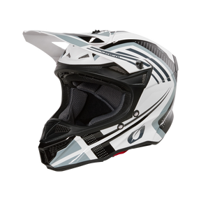 Il casco O'NEAL 5SRS Polyacrylite SPIKE, un casco da motocross bianco e nero con motivi geometrici, visiera, calotta in ABS, aperture di ventilazione e interni imbottiti di O'NEAL, è mostrato su uno sfondo nero.
