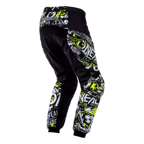 El pantalón O'NEAL ELEMENT infantil ATTACK presenta llamativos estampados gráficos en verde, blanco y gris con texto y motivos abstractos. Mostrado desde la parte trasera/lateral sobre un fondo transparente. Perfecto para jóvenes pilotos de motocross.