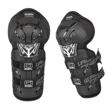A pair of O'NEAL PRO III Knee Guard CARBON in black with adjustable straps and a stylish carbon look pattern on a black background.