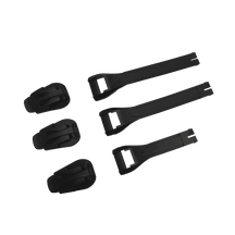 Five black plastic parts from the O'NEAL RSX Boot Full Buckle/Strap Kit: three rounded clips on the left side and two longer, flat, forked straps on the right side, all arranged in rows against a solid green background.