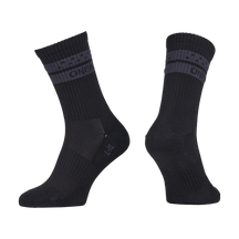 Two black O'NEAL MTB performance socks SOLID with ribbed cuffs and dark gray stripes in the upper area. The O'NEAL logo in gray is visible. Shown side by side on a white background, ideal as MTB socks. Color: black.