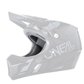 El casco O'NEAL Liner & Cheek Pads Sonus es un casco integral de motocross negro y gris con un diseño anguloso, puntos de ventilación y la inscripción "O'NEAL" en el lateral.