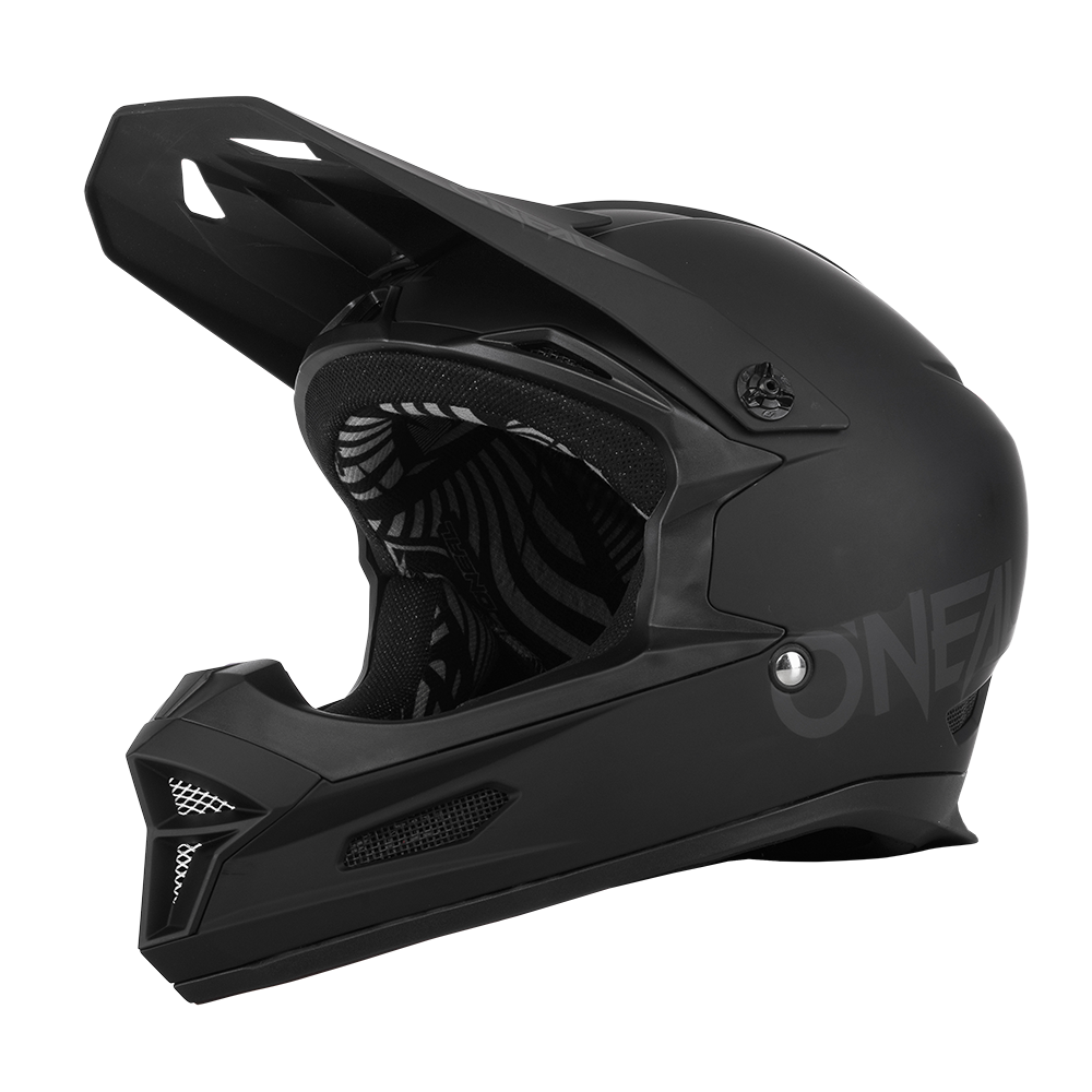 Der O'NEAL FURY Helm SOLID ist ein mattschwarzer Integralhelm mit Visier, Kinnschutz, Belüftungsöffnungen und gemustertem Innenfutter. Das "O'NEAL"-Branding befindet sich dezent an der Seite. Geeignet für Motocross und Mountainbiking.
