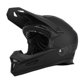 Il casco O'NEAL Fury Solid è un casco integrale di colore nero opaco con visiera, mentoniera, aperture di ventilazione e rivestimento interno a fantasia. Il marchio "O'NEAL" è posizionato in modo discreto sul lato. Adatto per motocross e mountain bike.