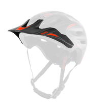 The O'NEAL Visor DEFENDER Helmet TRIBAL is a black helmet with red accents, ventilation holes, an adjustable chin strap and a front visor, shown on a transparent background.