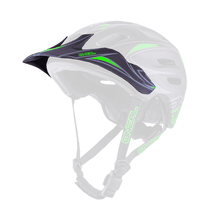 The O'NEAL Visor DEFENDER Helmet TRIBAL is a black and green mountain bike helmet with adjustable chin strap, front visor and ventilation openings.