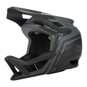 Der O'NEAL TRANSITION Helm FLASH ist ein mattschwarzer und grauer Fullface-Mountainbike-Helm mit großem Visier, Kinnschutz, mehreren Belüftungsöffnungen und einem auffälligen "O'NEAL"-Branding für optimalen Schutz.