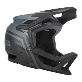 Der O'NEAL TRANSITION Helm FLASH von O'NEAL ist ein mattschwarzer und grauer Fullface-Mountainbike-Helm mit verlängertem Visier, Kinnschutz, aerodynamischem Design und auffälligem Seitenbranding für optimalen Schutz.