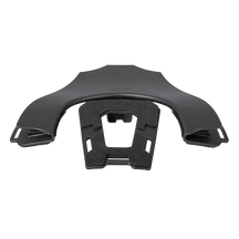 The O'NEAL Back Frame TRON Neckbrace is a black component with slots and cutouts shown from the front on a white background. This part serves as a bracket or support in the O'NEAL neckbrace assembly.