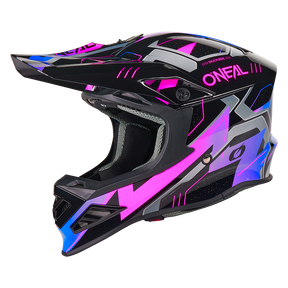 El casco O'NEAL F-SRS CRUX es un casco integral de motocross con un diseño moderno y geométrico en negro, gris, rosa y azul. Tiene visera, una gran mentonera y la llamativa marca "O'NEAL" rosa en el lateral.