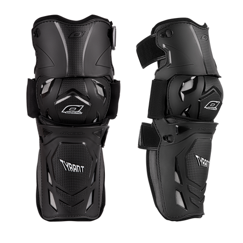 Two black O'NEAL TYRANT MX knee pads with adjustable straps feature hard outer shells and padding for protection, shown in front and side view.