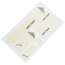 A white sheet with several cream-colored AZONIC FRAME GUARDS, each with the lettering "AZONIC" and a triangular logo, arranged in different shapes and sizes for protection or decoration.