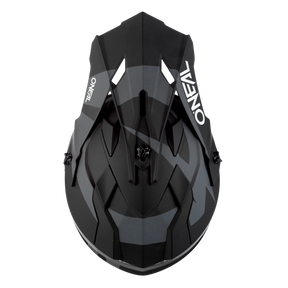 Vue de dessus du casque O'NEAL 2SRS SLICK en noir avec des accents blancs et gris, avec le branding O'NEAL accrocheur sur les deux côtés - un must pour tout motard sérieux.