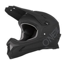 The O'NEAL Sonus helmet SOLID is a matte black full-face MTB helmet with visor and chin guard, with large O'NEAL branding on the side and gray-black inner padding.