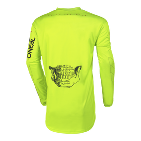 Das O'NEAL Custom Jersey Kinder ATTACK ist ein leuchtend gelbes Langarmtrikot mit dem Schriftzug "O'NEAL" auf dem Ärmel und einem schwarzen anatomischen Kieferknochenmotiv auf dem Rücken, das auf weißem Hintergrund abgebildet ist.
