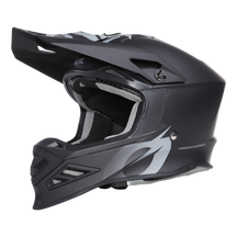 Der O'NEAL F-SRS Helm SOLID, ein mattschwarzer Integralhelm für Motocross mit Visier und weißen Grafiken, verfügt über Sicherheitsfunktionen wie einen belüfteten Mundschutz, ein eckiges Design und einen Kinnriemen für optimalen Kopfschutz.