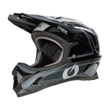 The O'NEAL Sonus helmet youth SPLIT is a black and gray full-face youth helmet with visor, padded interior and the O'NEAL logo on the side, which is displayed on a black background.