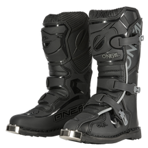 A pair of black O'NEAL TRIBUTE boots youth motocross boots with metal caps, thick soles, protective plates, adjustable buckles on the front and side and the gray O'NEAL logo.