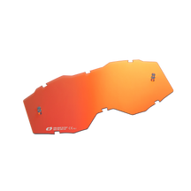Die O'NEAL B-10 Youth Goggle Ersatzlinse ist eine orangefarbene, unregelmäßig geformte Linse mit einer reflektierenden Oberfläche und zwei Metallschrauben auf einer Seite, die auf einem schwarzen Hintergrund abgebildet ist.