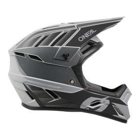Side view of the O'NEAL BACKFLIP helmet ECLIPSE, a black, white and gray full-face MTB helmet with eye-catching geometric patterns, "O'NEAL" branding on the visor and on the side, ventilation openings and a robust chin guard.