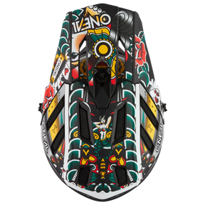 A black jet ski seen from above, decorated with bold, tattoo-inspired red, green, yellow and white floral and geometric patterns. The lettering "O'NEAL" is attached to the sides and reflects the characteristic style of the O'NEAL BACKFLIP helmet INKED.