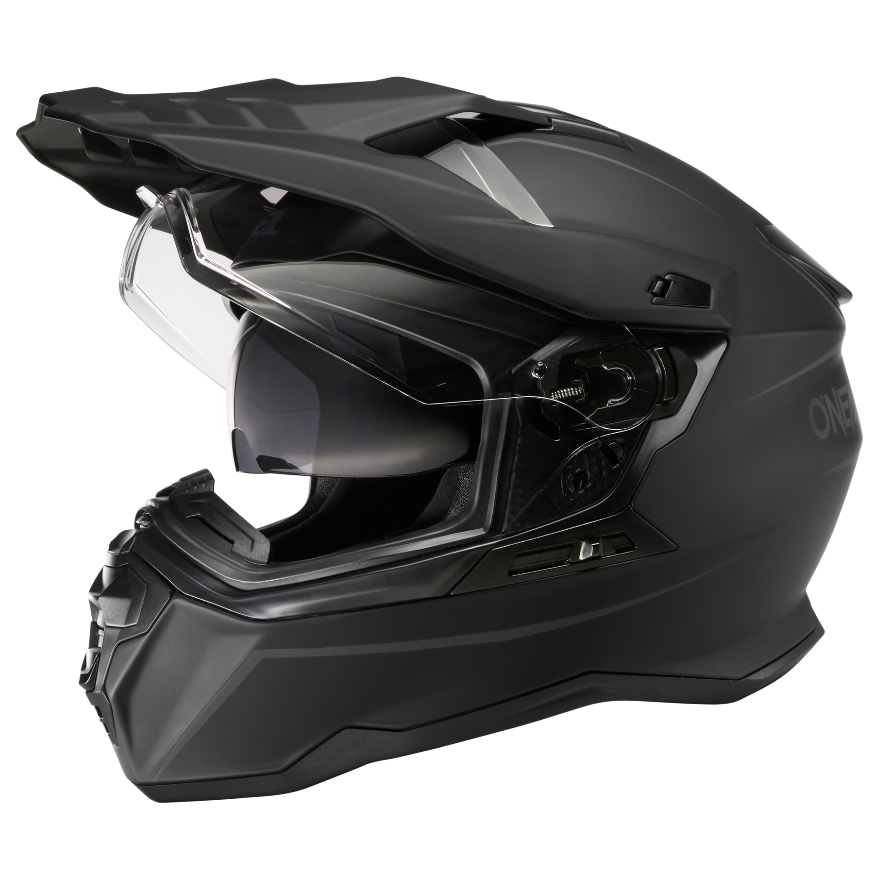 Der O'NEAL D-SRS Helm SOLID, ein mattschwarzer Integralhelm mit Visier und kantigen Linien, wird von der Seite vor einem unifarbenen Hintergrund dargestellt.
