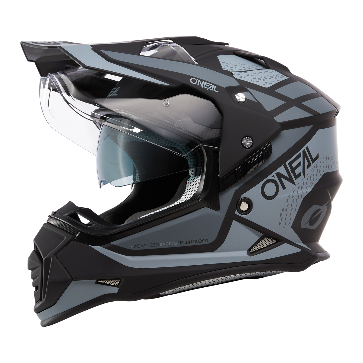The O'NEAL SIERRA helmet R by O'NEAL in black and gray with a clear visor, angular design and detailed ventilation openings is shown from the side against a white background.