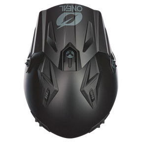 Top view of the matt black O'NEAL VOLT helmet SOLID with angular ventilation openings and a light gray O'NEAL logo in the upper part of the front.