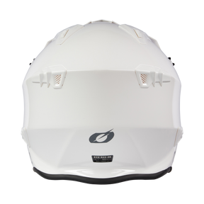 The O'NEAL VOLT helmet SOLID in white shows a black O'NEAL logo and a certification label near the bottom as well as rear ventilation openings when viewed from behind.