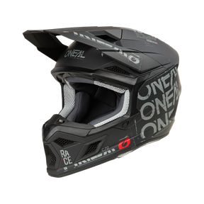 Il casco O'NEAL 3SRS STATIC è un casco integrale da motocross nero e grigio con motivi geometrici e una visiera su sfondo nero.