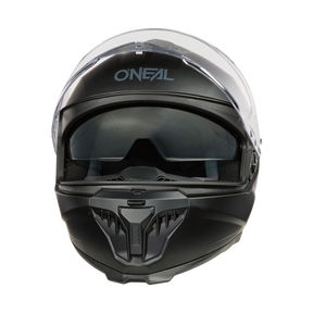 Casco de moto O'NEAL Challenger negro Solid con visera transparente y visor solar incorporado, mostrado en vista frontal sobre fondo transparente. Fabricado en ABS duradero.