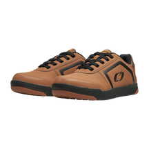 The O'NEAL PINNED FLAT pedal shoe by O'NEAL in brown and black with side logo is a lace-up cycling shoe designed for optimal grip when riding with flat pedals and features a plain black background.
