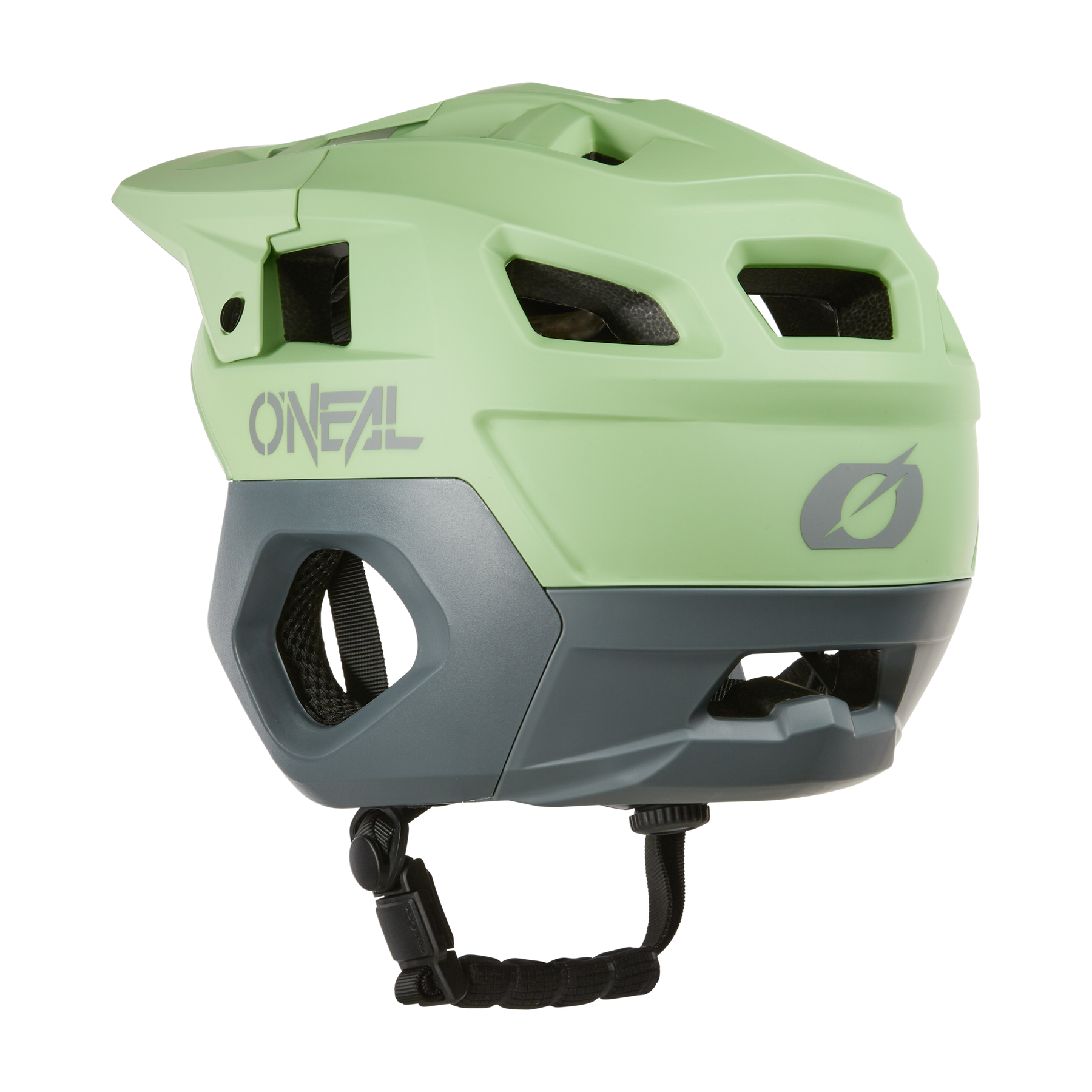 Le casque O'NEAL TRAPPER Helmet SOLID en vert clair et gris dispose de grandes ouvertures d'aération, d'une visière et d'une jugulaire réglable - ici vu de l'arrière - et est idéal comme casque d'enduro pour le confort et la protection.