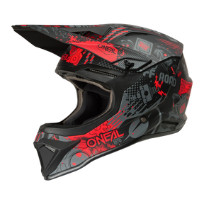 El casco O'NEAL 1SRS VIBRANT se caracteriza por un diseño negro y rojo con llamativos gráficos angulosos, la inscripción "ONEAL", el texto "OFF ROAD" y varios dibujos y símbolos estilizados en la calota.