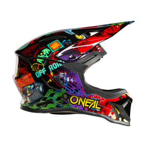Le casque O'NEAL 1SRS Youth Helmet VIBRANT est un casque tout-terrain coloré avec une visière, des graphismes accrocheurs, des inscriptions de graffitis et des illustrations de dessins animés. L'inscription "O'NEAL" est placée bien en évidence sur le côté.
