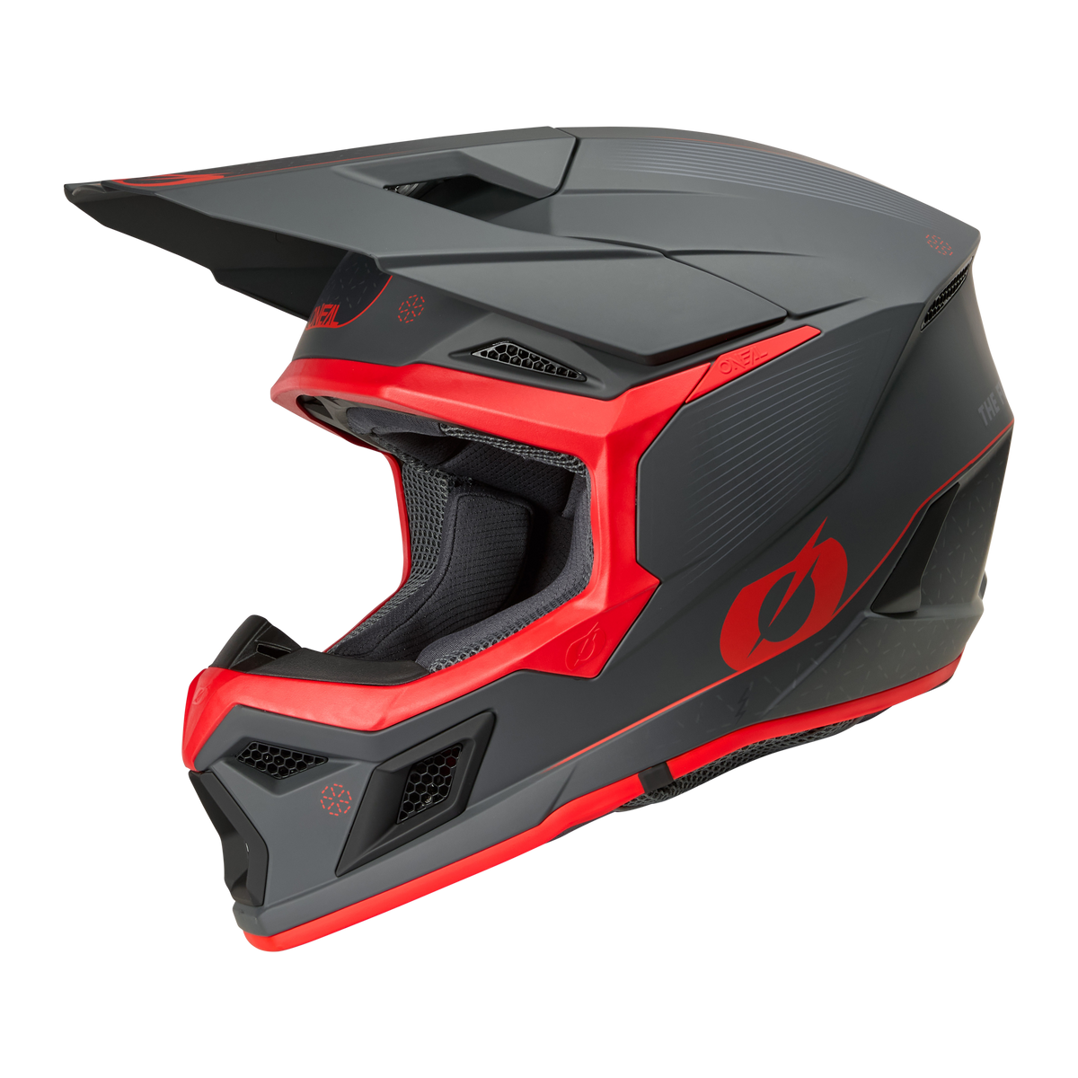 The O'NEAL 3SRS E-STROKE helmet is a matte black and red full-face motocross helmet with an angular design, striking visor and ventilation openings on a white background.