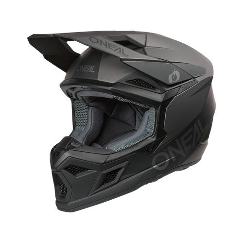 Der O'NEAL 3SRS Helm SOLID in schwarz/grau ist ein mattschwarzer MX-Fullface-Helm mit Visier, Belüftungsöffnungen, auffälligem O'NEAL-Branding und gepolsterter grauer Innenausstattung - ideal für Motocross-Fahrer, die Stil und Komfort suchen.