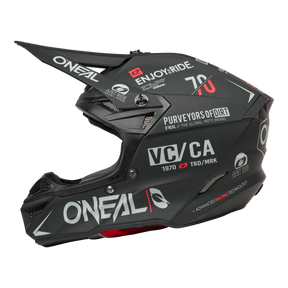 The O'NEAL 5SRS Polyacrylite Helmet BRAND is a matt black motocross helmet with visor, eye-catching white and red graphics, the O'NEAL logo, "Purveyors of Dirt" and various stickers on the sides and back.