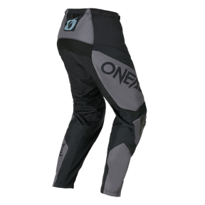 The O'NEAL ELEMENT Pants RACEWEAR are gray and black motocross pants with O'NEAL branding on the side, elastic waistband and reinforced knee sections on a plain background.