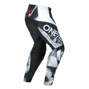 El pantalón O'NEAL Element ROLLER tiene un diseño ajustado en negro, blanco y gris con el texto "O'NEAL" en negrita en el lateral, dibujos gráficos y un logotipo rojo en la cintura.