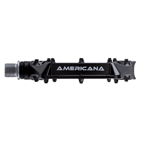 Un pedal AZONIC AMERICANA negro, con el logotipo "AMERICANA" en blanco en el lateral, sobre fondo negro.