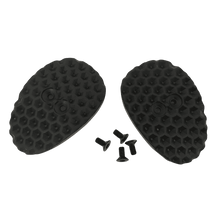 El Juego de Cubrecalas O'NEAL para zapatillas SPD consta de dos tapas ovaladas, negras y texturizadas, con un dibujo de panal de abeja, y cuatro pequeños tornillos negros, todo ello sobre un fondo monocolor.