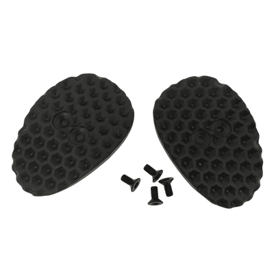El Juego de Cubrecalas O'NEAL para zapatillas SPD consta de dos tapas ovaladas, negras y texturizadas, con un dibujo de panal de abeja, y cuatro pequeños tornillos negros, todo ello sobre un fondo monocolor.