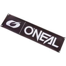 The O'NEAL Track Banner is a black rectangular banner with the white O'NEAL logo and text, with metal eyelets in each corner for easy hanging.